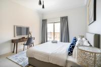 Postel nebo postele na pokoji v ubytování SIMPLY COMFORT in Sarai Palm Jumeirah
