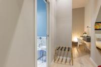 Łóżko lub łóżka w pokoju w obiekcie Deluxe apartment Milia Agrigento