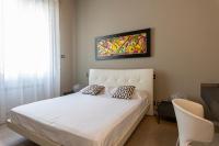 Łóżko lub łóżka w pokoju w obiekcie Deluxe apartment Milia Agrigento