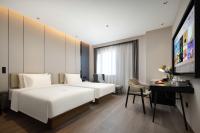 Atour Hotel Tianjin Zhongbei Haitai Industrial Parkにあるベッド