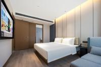 Atour Hotel Tianjin Zhongbei Haitai Industrial Parkにあるベッド