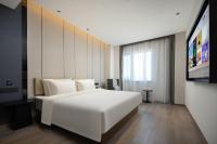 Atour Hotel Tianjin Zhongbei Haitai Industrial Parkにあるベッド
