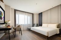 Atour Hotel Tianjin Zhongbei Haitai Industrial Parkにあるベッド