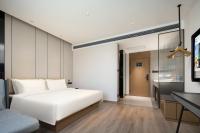 Atour Hotel Tianjin Zhongbei Haitai Industrial Parkにあるベッド