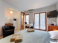 Televízia a/alebo spoločenská miestnosť v ubytovaní Apartment Alba-3 by Interhome