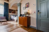 a room with a bedroom with a bed and a door at Hotel Mercier in Amsterdam