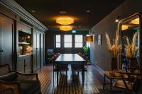 a dining room with a table and chairs at Hotel Mercier in Amsterdam