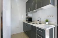 A kitchen or kitchenette at APARTMENT TIMPLE Puerto del Carmen