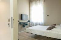 Łóżko lub łóżka w pokoju w obiekcie Deluxe apartment Milia Agrigento