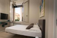 Łóżko lub łóżka w pokoju w obiekcie Deluxe apartment Milia Agrigento
