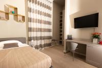 Telewizja i/lub zestaw kina domowego w obiekcie Deluxe apartment Milia Agrigento