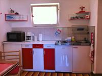 Kuchyňa alebo kuchynka v ubytovaní Villa Rose Apartment