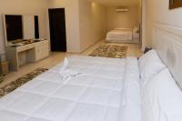 Postel nebo postele na pokoji v ubytování Pyramids Land Hotel