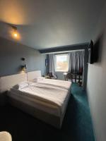A bed or beds in a room at Hotel Rila