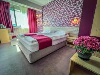 A bed or beds in a room at Hotel Rila