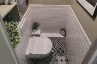 a bathroom with a white toilet and a tile floor at Beautiful duplex on the outskirts of Paris - Welkeys in Levallois-Perret