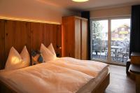 A bed or beds in a room at Apartment in Bramberg am Wildkogel with barbecue