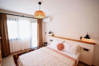 Postel nebo postele na pokoji v ubytování Kallinos Boutique Hotel