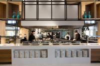 un grupo de personas en una cocina preparando comida en Agapi Beach Resort Premium All Inclusive, en Amoudara Herakliou