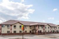 a large building with a sign in front of it at Super 8 by Wyndham Rock Springs in Rock Springs