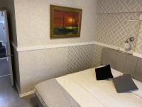 Postel nebo postele na pokoji v ubytování antik sofia hotel