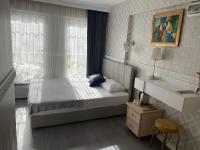 Postel nebo postele na pokoji v ubytování antik sofia hotel