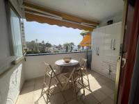 A balcony or terrace at Apartamento con piscina climatizada y vista al mar