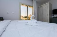 Postel nebo postele na pokoji v ubytování Pyramids Land Hotel