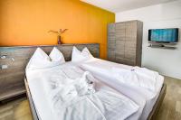 Posteľ alebo postele v izbe v ubytovaní Hotel Hofmann