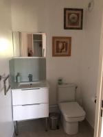 a bathroom with a white sink and a toilet at Les rêves de Walt Disney in Chessy