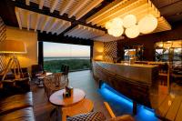 a restaurant with a large wooden boat on the wall at Hotel Antonio in Zahara de los Atunes