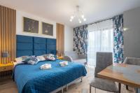 Posteľ alebo postele v izbe v ubytovaní Apartament 38 i 37 Okrzei 1c