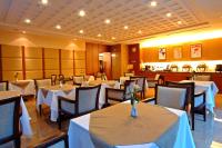 a restaurant with tables and chairs with white table cloth at Jingan Classic Inn in Zhonghe