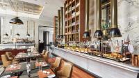 a bar at a restaurant with tables and chairs at The St. Regis Kuala Lumpur in Kuala Lumpur