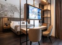 A bed or beds in a room at Duomo Hotel & Apartments