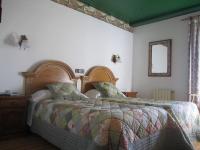 Postel nebo postele na pokoji v ubytování San Marsial Benasque Apart Hotel