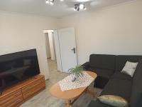 Televízia a/alebo spoločenská miestnosť v ubytovaní APARTAMENT CENTRUM Międzychód
