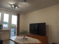 Televízia a/alebo spoločenská miestnosť v ubytovaní APARTAMENT CENTRUM Międzychód