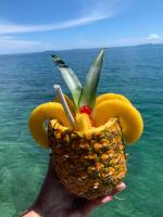a person holding up at Ponci’s Gate to Gaia Holistic Center in Bocas del Toro