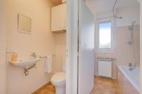 a bathroom with a sink toilet and a window at Cap et Soleil - Happy Rentals in Antibes