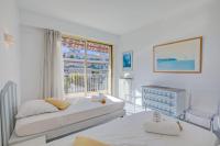 Ein Bett oder Betten in einem Zimmer der Unterkunft Appartement Le Fabiola - Happy Rentals