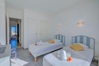 Ein Bett oder Betten in einem Zimmer der Unterkunft Appartement Le Fabiola - Happy Rentals