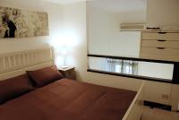 A bed or beds in a room at Palazzo Velli Suites