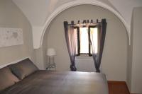 A bed or beds in a room at Palazzo Velli Suites