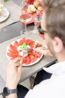 a man sitting at a table with a plate of food at Relais Del Maro in Borgomaro