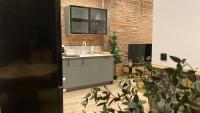Kuchyň nebo kuchyňský kout v ubytování SUITE HAUS BAHIA