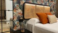 Postel nebo postele na pokoji v ubytování SUITE HAUS BAHIA