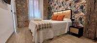 Postel nebo postele na pokoji v ubytování SUITE HAUS BAHIA