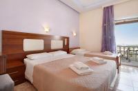 A bed or beds in a room at Zante View Studios & Villas
