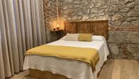 Postel nebo postele na pokoji v ubytování SUITE HAUS BAHIA